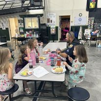 Community engagement at Atchison After School Club summer program lunch event